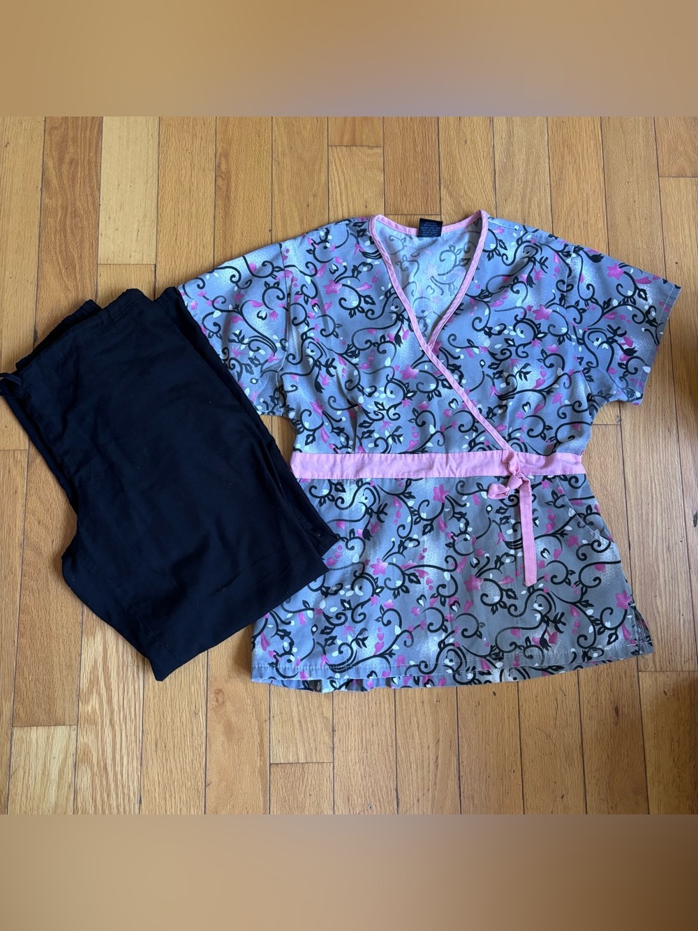 Women's Gray Wrap Sleep Top with Pink Trim and black cargo pants scrub set